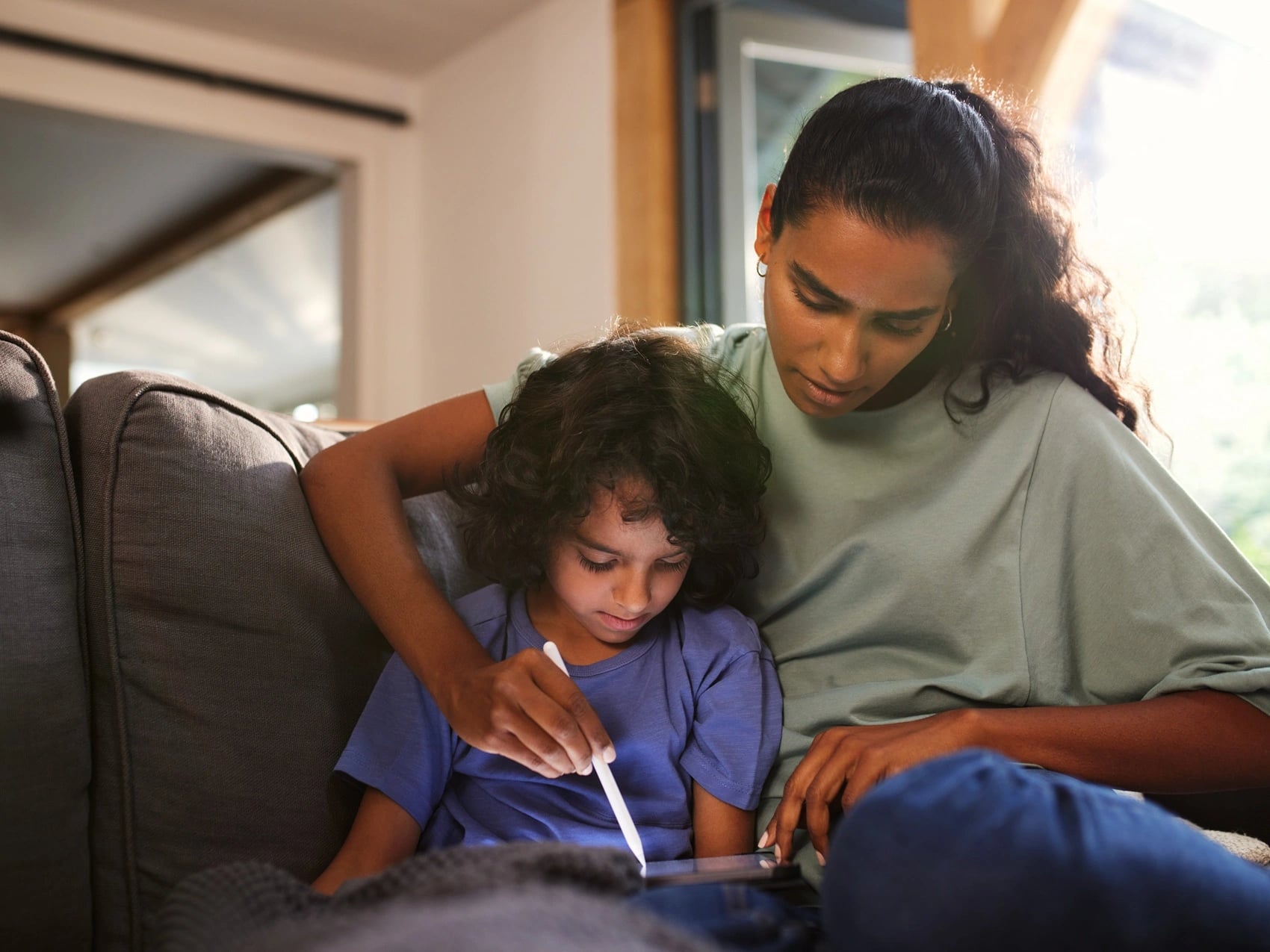 Parent caring for sick child at home while booking a carer's leave certificate through OMC Health