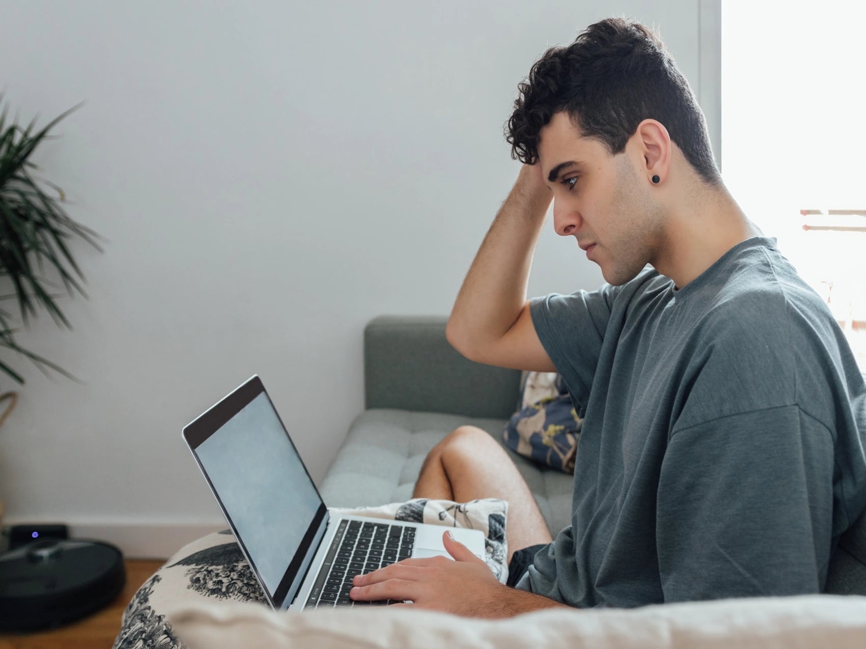 University student at home using laptop to book a student medical certificate through OMC Health